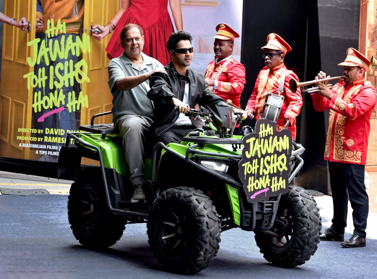 Varun Dhawan and David Dhawan ride together at trailer launch