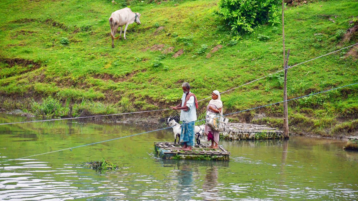 Villagers cross Kolong River on makeshift raft in Nagaon