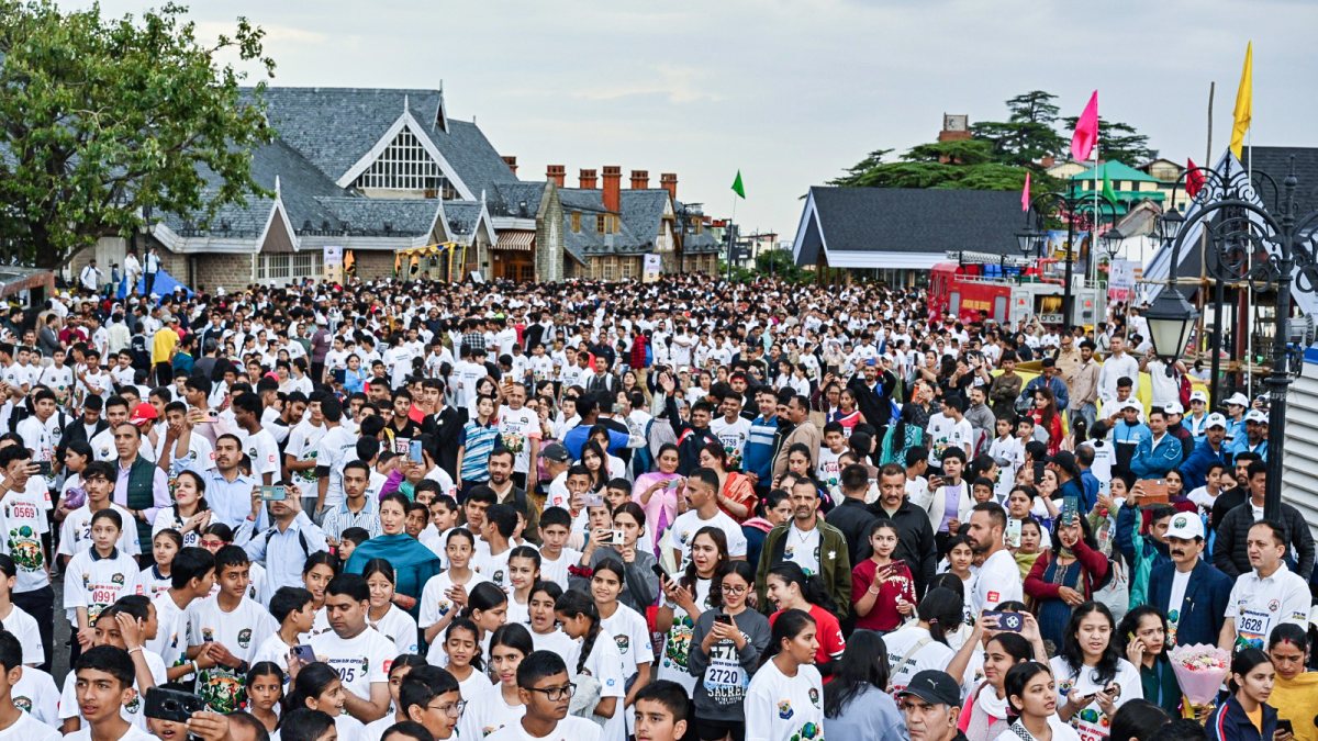 People take part in Mini Marathon organised by Himachal Pradesh Police on the…