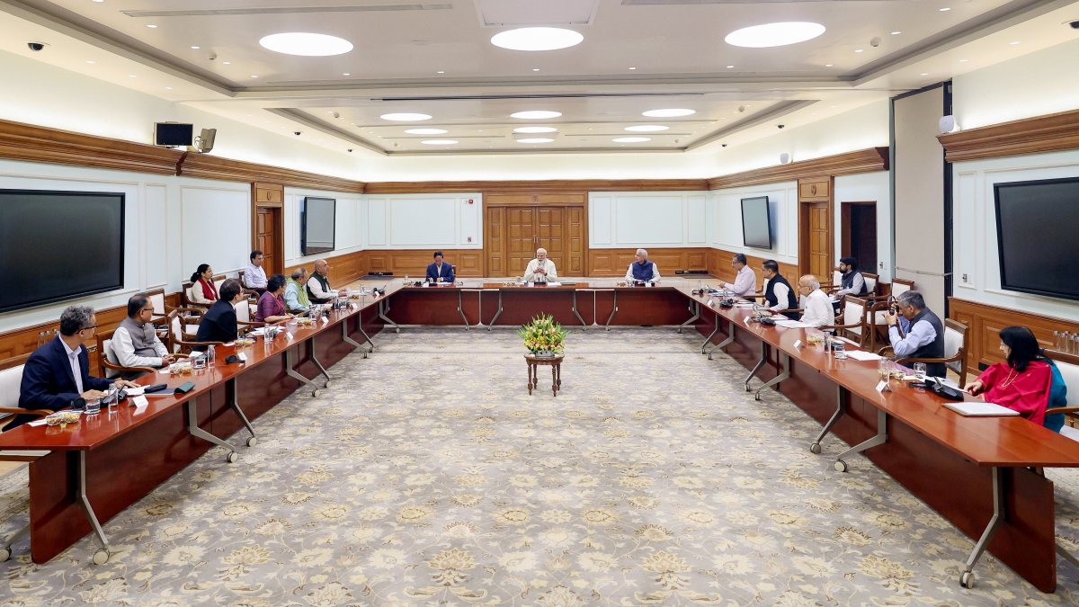 Prime Minister Narendra Modi chairs a meeting with members of the PM-Economic…