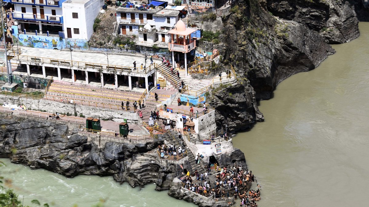 Devotees bathe at Sangam of Alaknanda and Bhagirathi in Devprayag