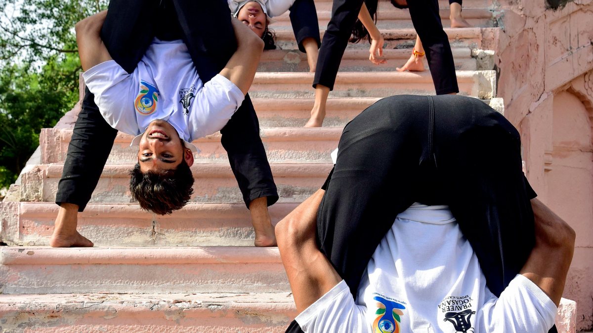 People perform yoga in Bikaner park ahead of International Yoga Day