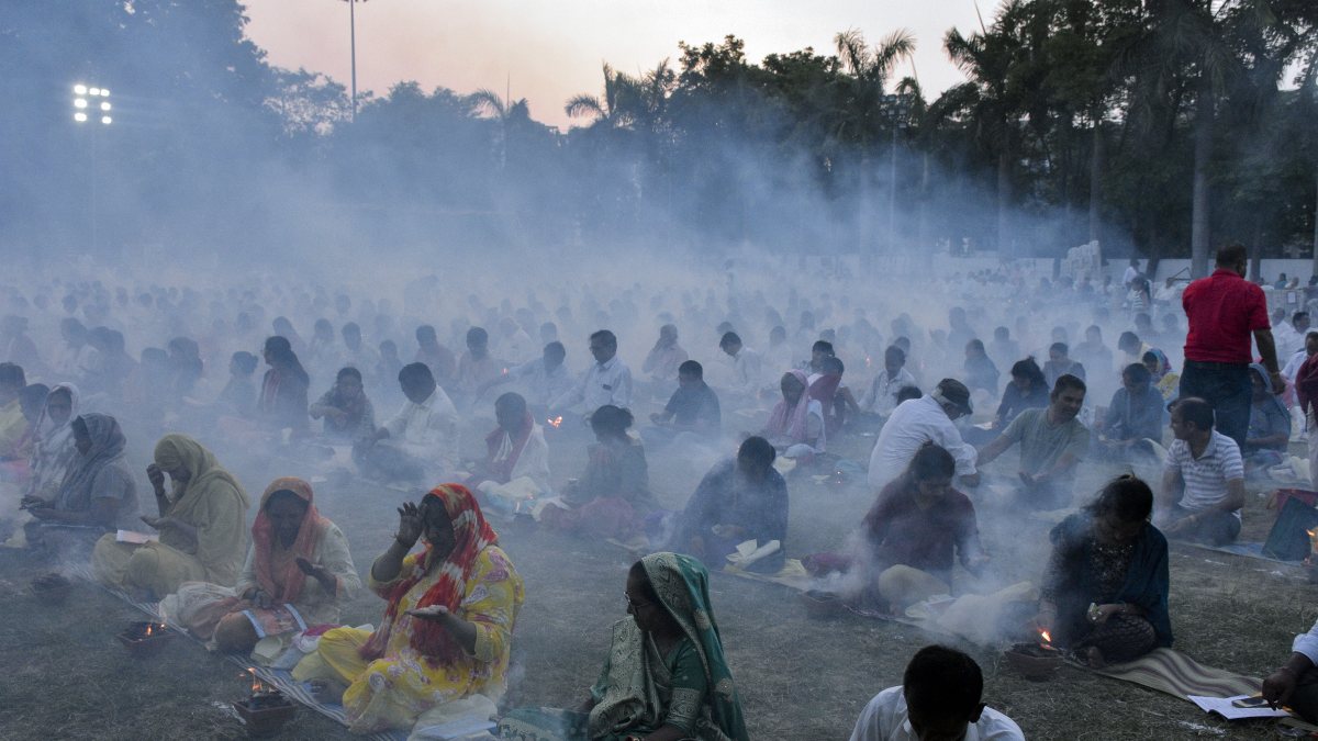 People participate in the mass Agnihotra hawan during a Collective Agnihotra…