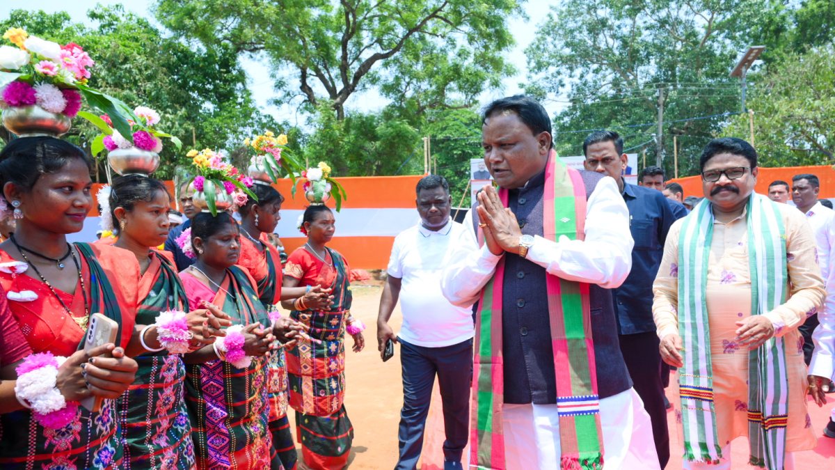 Odisha Chief Minister Mohan Charan Majhi greets the artists performing during…