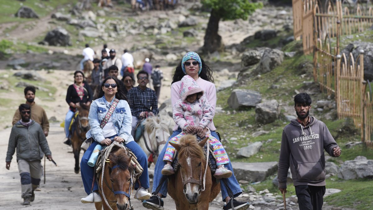 Tourists enjoy horse rides at Sonmarg in Ganderbal