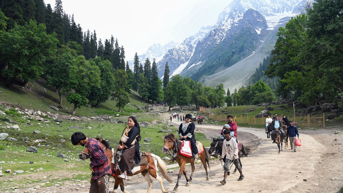 Tourists enjoy horse ride at Sonmarg in Ganderbal