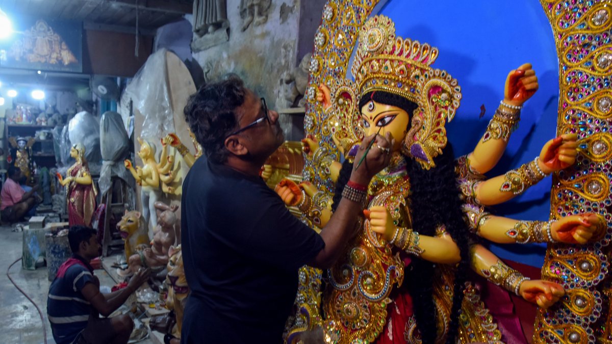 Artist adds final touches to Durga idol at Kumartuli