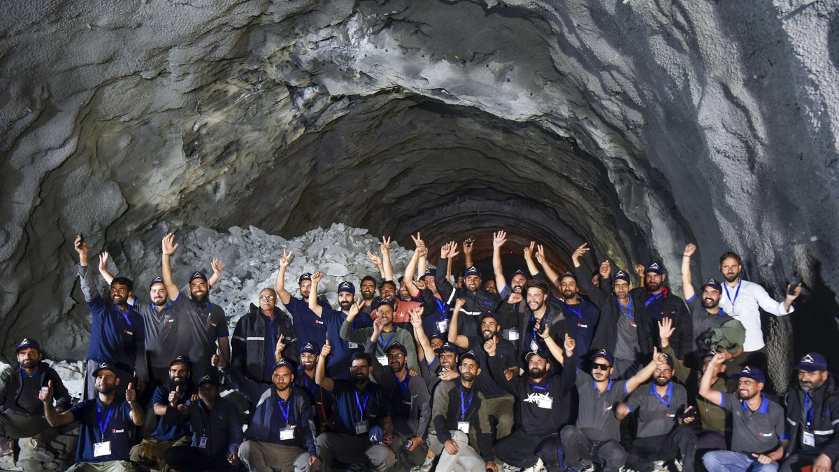 Workers celebrate Zojila tunnel breakthrough ceremony in Kargil
