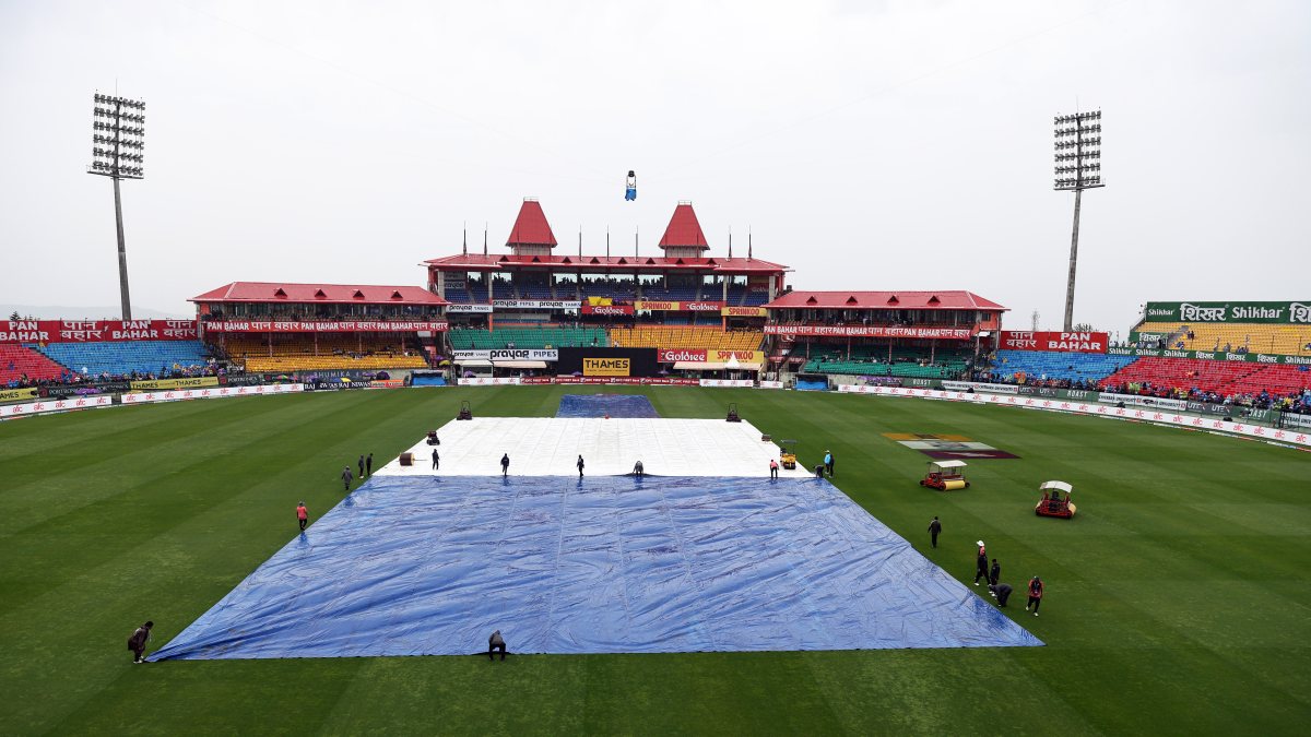 Ground staff cover pitch as rain delays India-Afghanistan ODI in Dharamsala