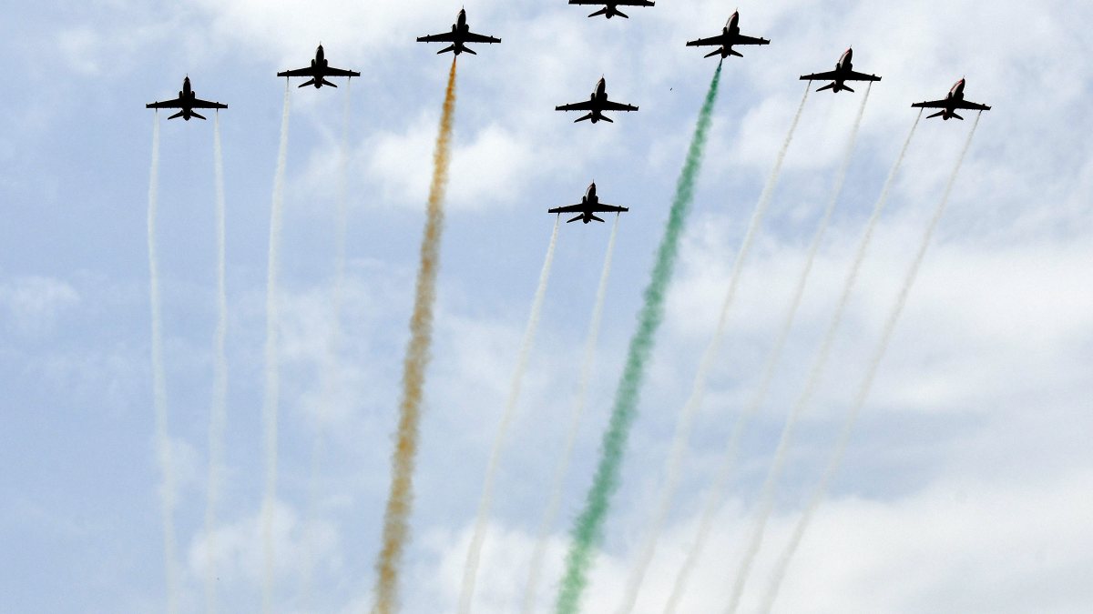 Surya Kiran Aerobatic Team performs an aerial display during the Combined…