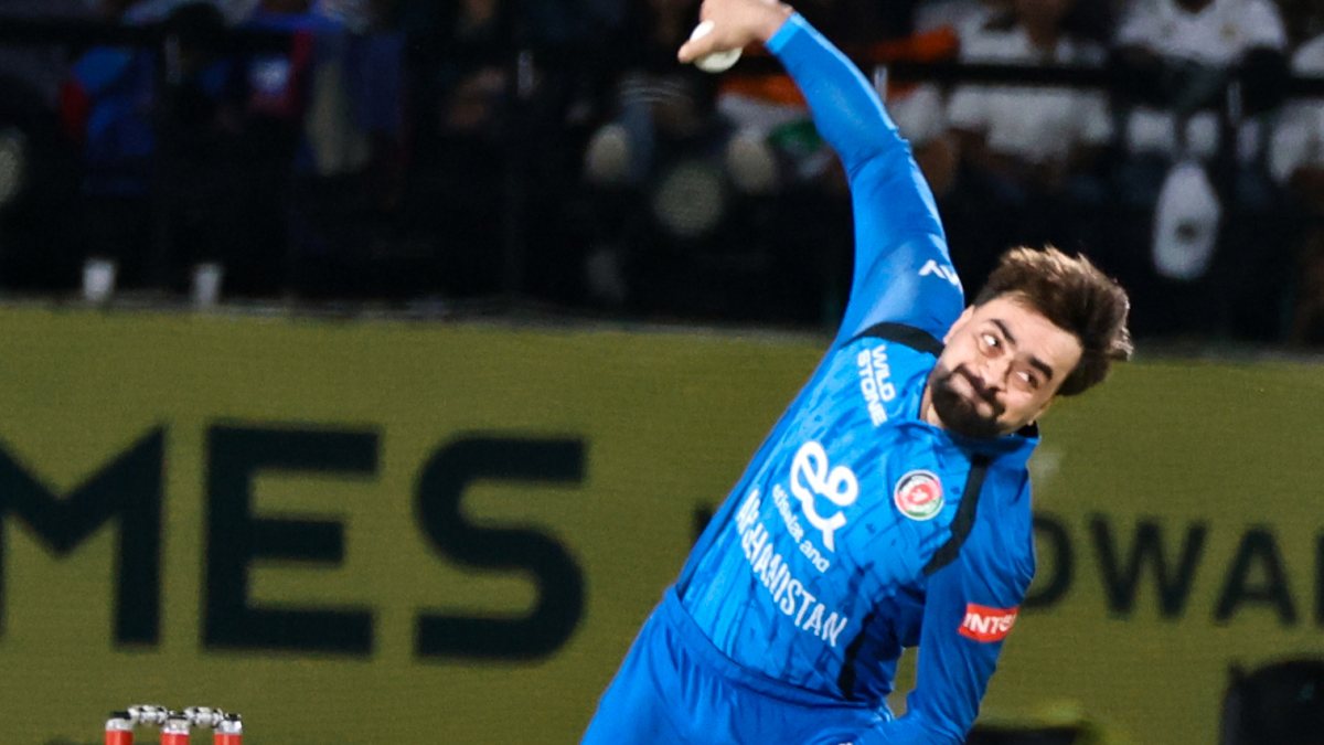 Rashid Khan bowls during first ODI against India in Dharamsala