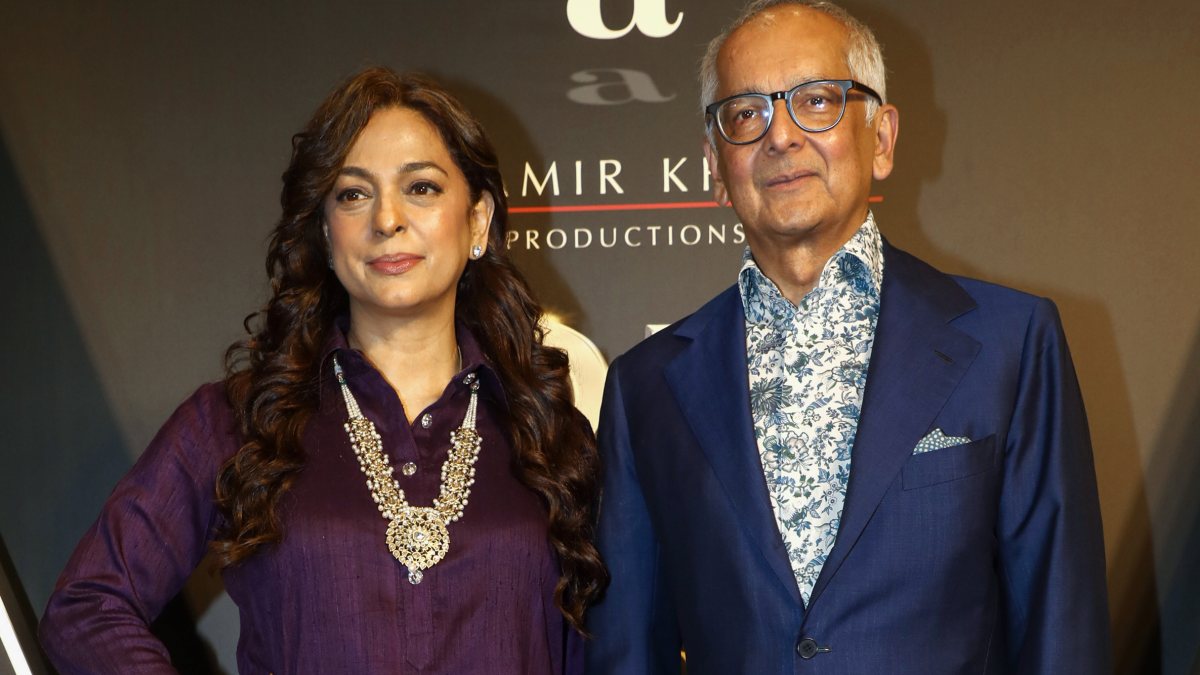 Bollywood actress Juhi Chawla with husband Jay Mehta pose for a photo during…