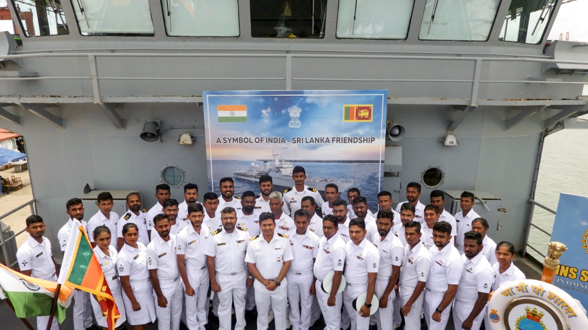 Indian and Sri Lankan Navy personnel pose after INS Sharda port call