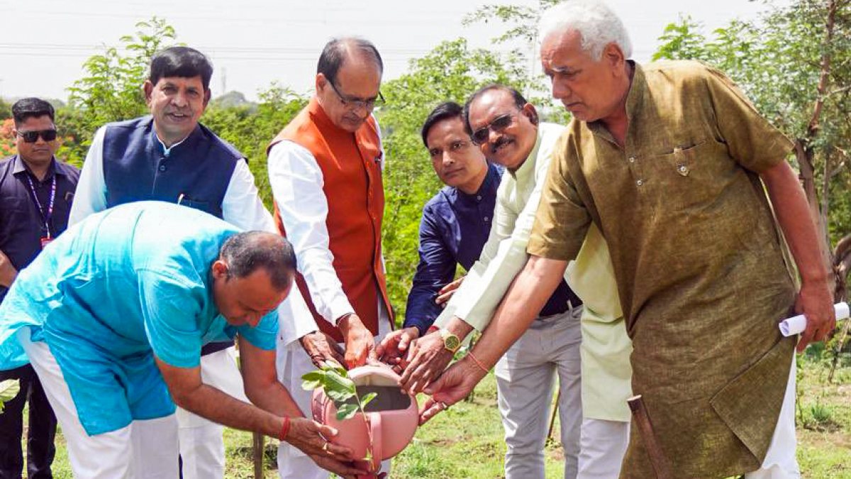 Shivraj Singh Chouhan waters sapling at Smart City Park in Bhopal