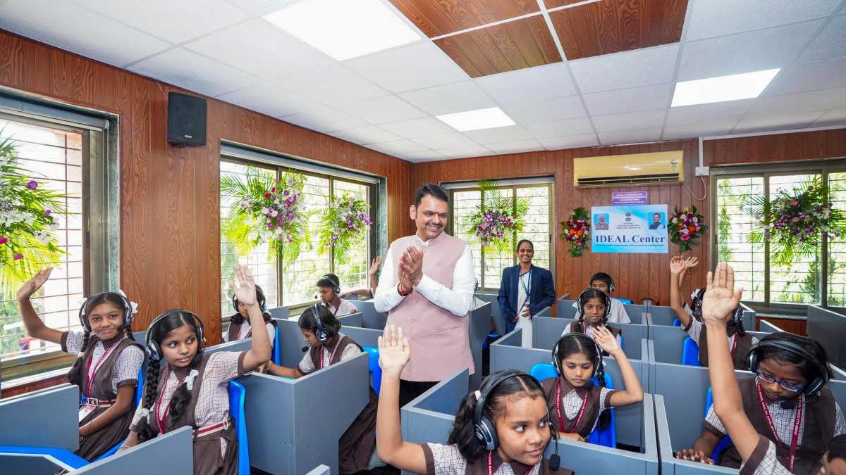 Maharashtra Chief Minister Devendra Fadnavis interacts with students during the…