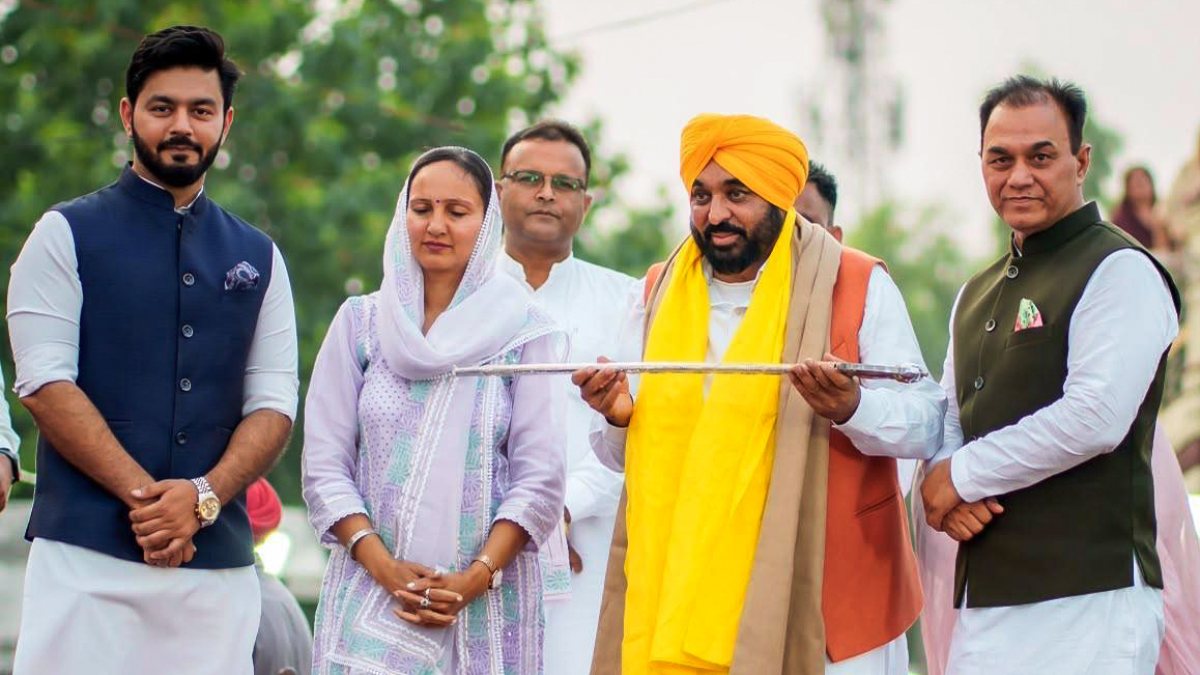 Punjab Chief Minister Bhagwant Mann holds a sword during 'People's Meet', in…