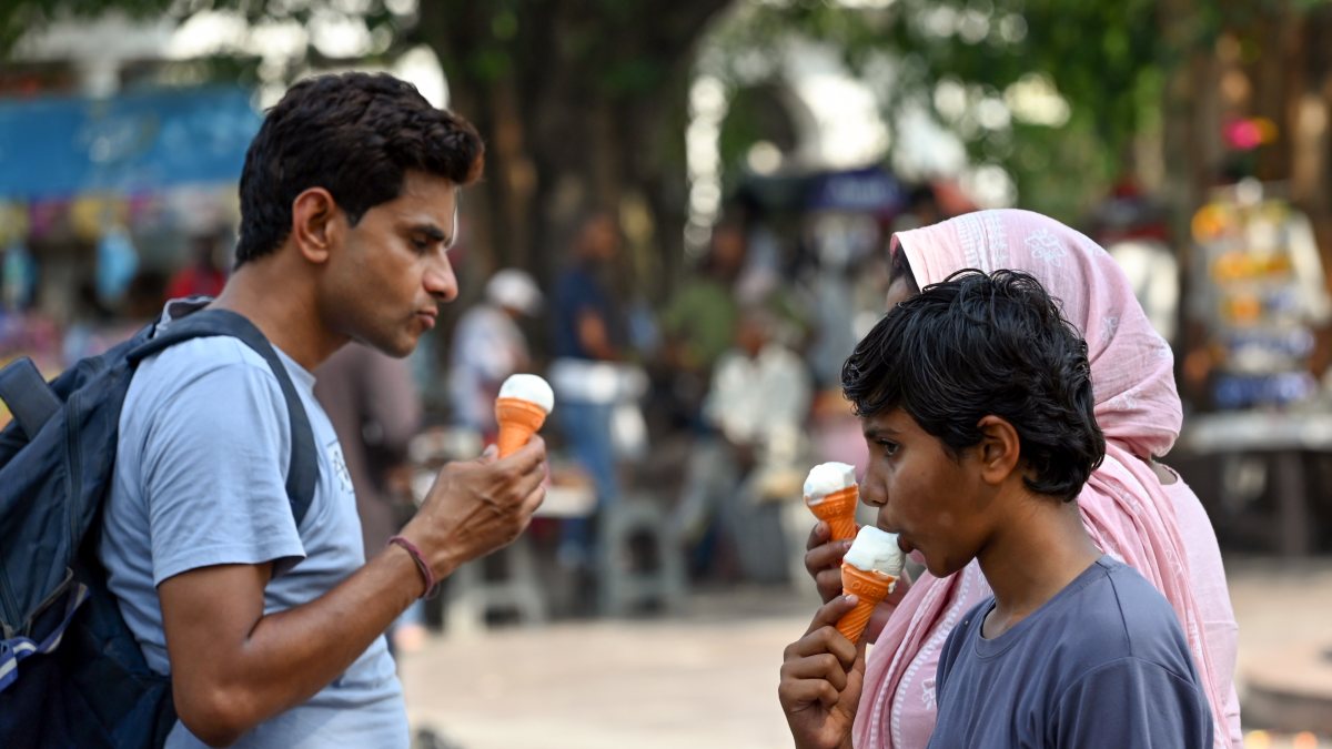 People eat ice cream to beat the heat in New Delhi