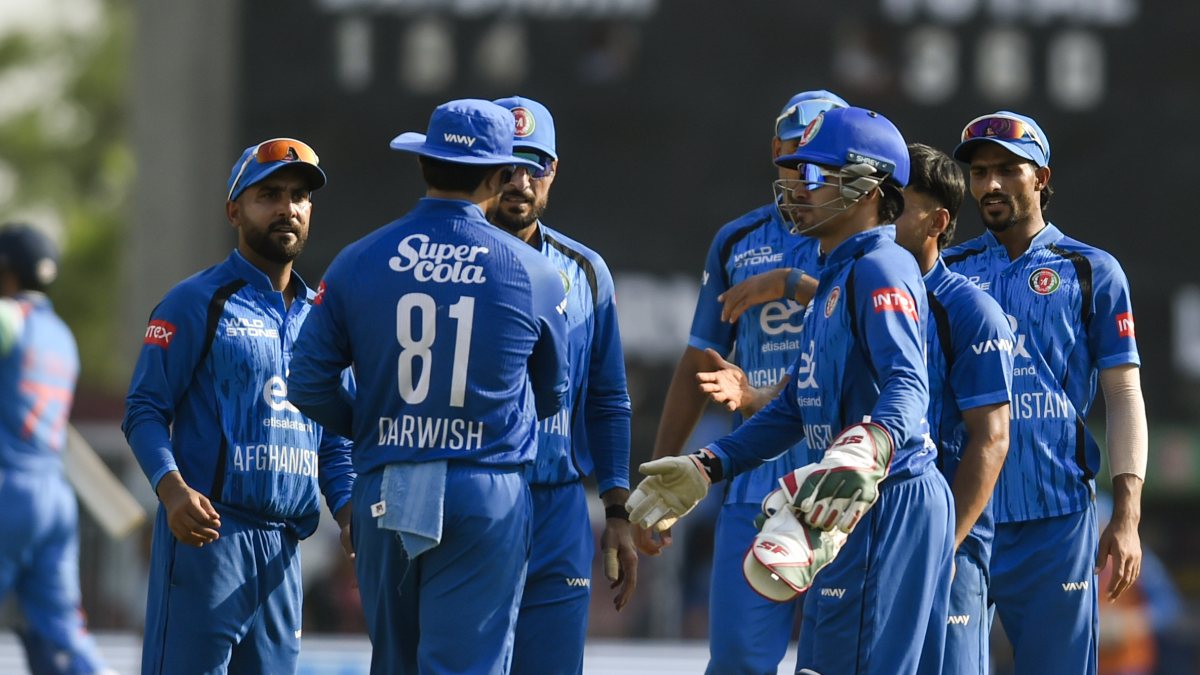 Afghanistan's Darwish Rasooli and teammates celebrate the wicket of Indian…