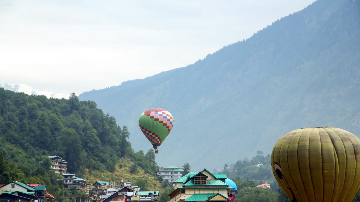 Tourists enjoy hot air balloon rides in Manali