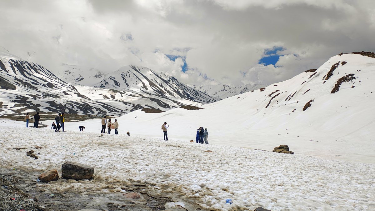 Tourists enjoy snow at Baralacha La Pass in Lahaul and Spiti