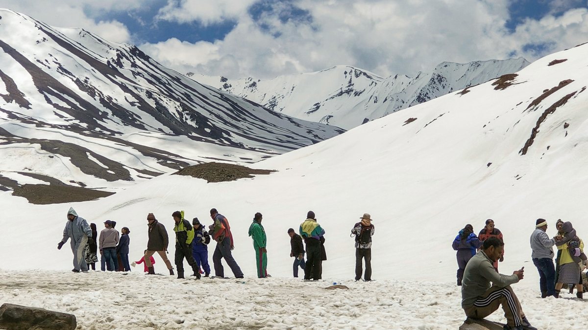 Tourists enjoy snow at Baralacha La Pass in Lahaul and Spiti