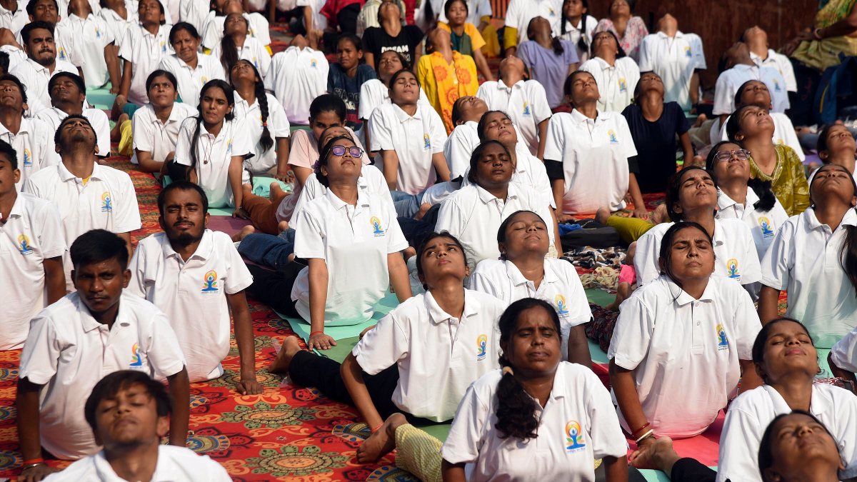 People perform yoga on Ganga banks ahead of International Yoga Day