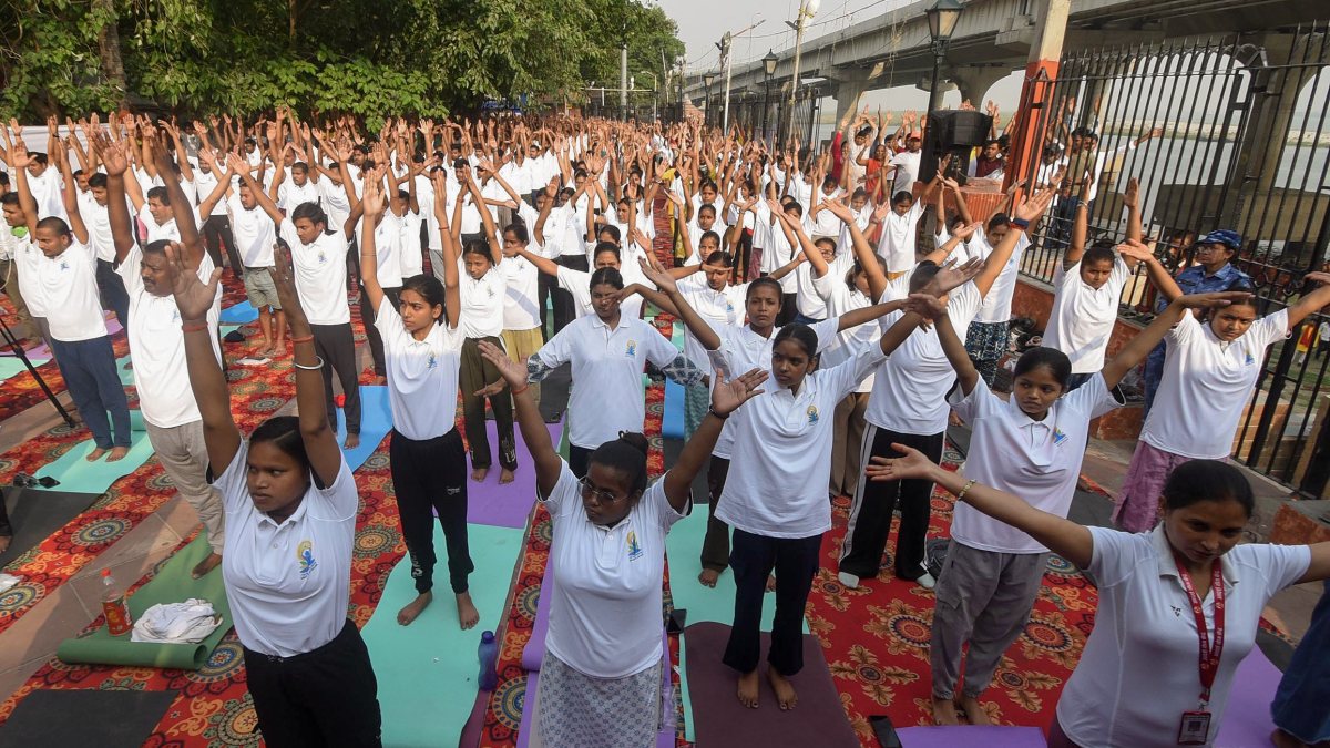 People perform yoga on Ganga banks ahead of International Yoga Day