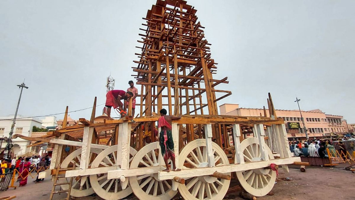 Artisans give final touches to wooden structure for Rath Yatra in Puri