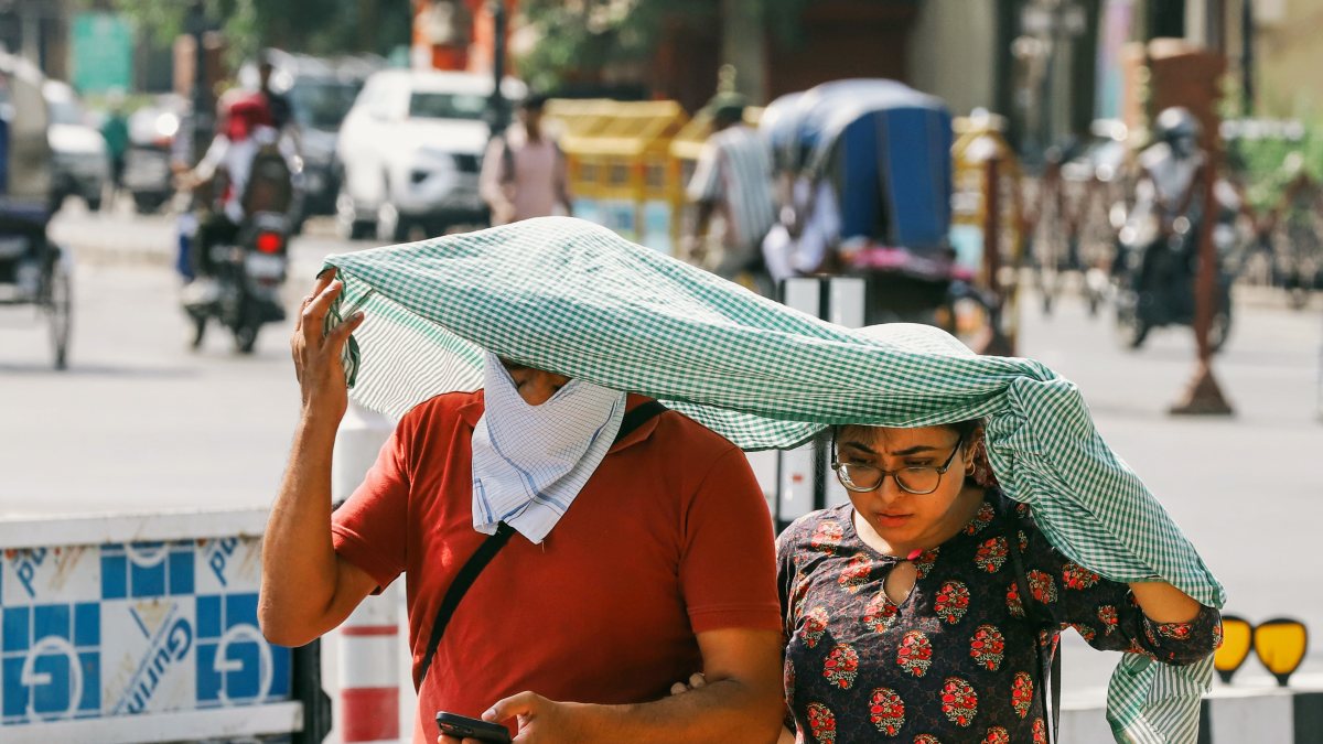 Lucknow residents shield themselves from scorching summer heat