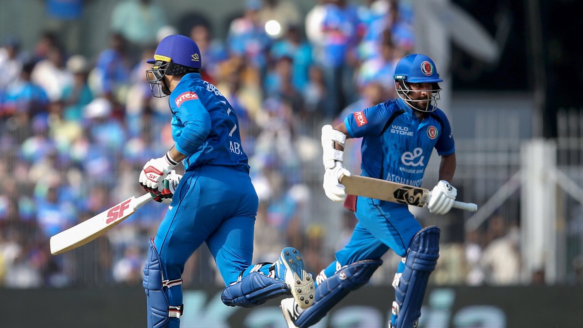 Afghanistan's Nabi and Shahidi run between wickets in Chennai ODI