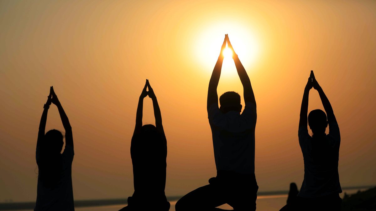 People practice yoga ahead of International Yoga Day in Prayagraj