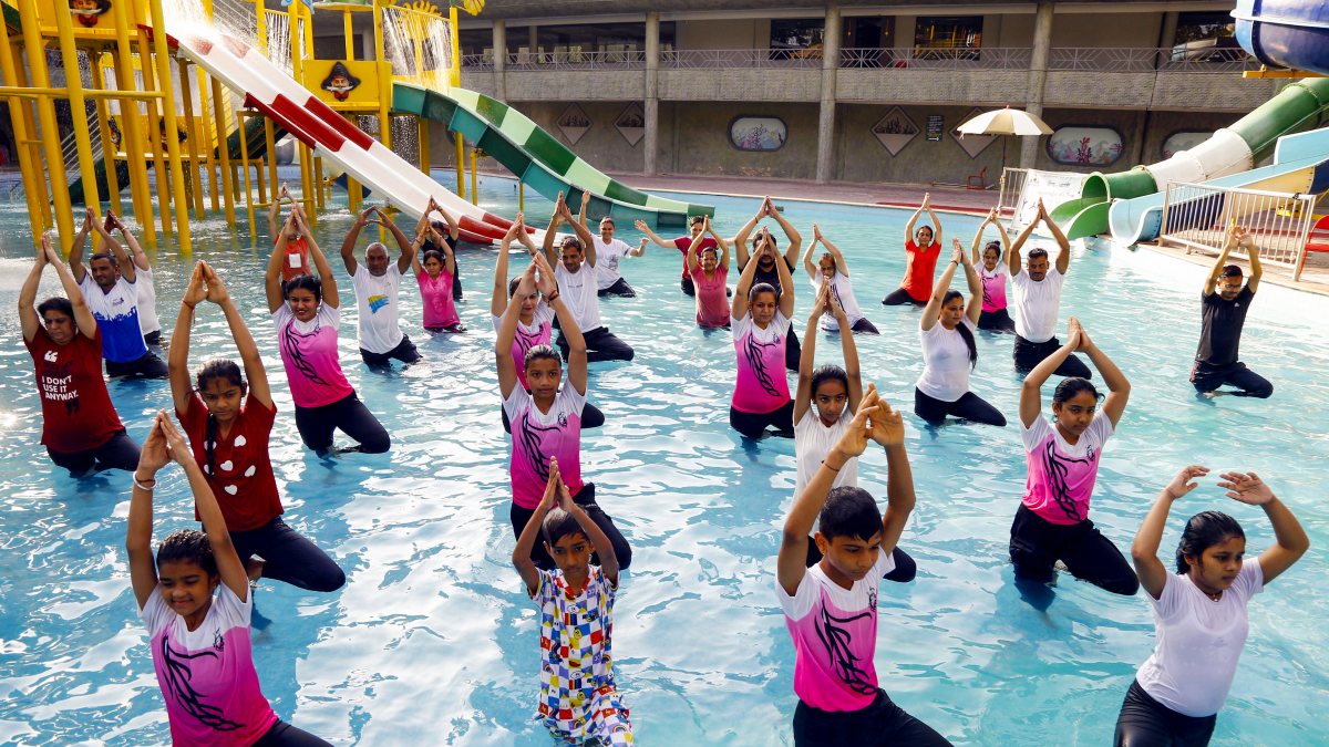 Children perform yoga in a pool at Sabarmati riverfront