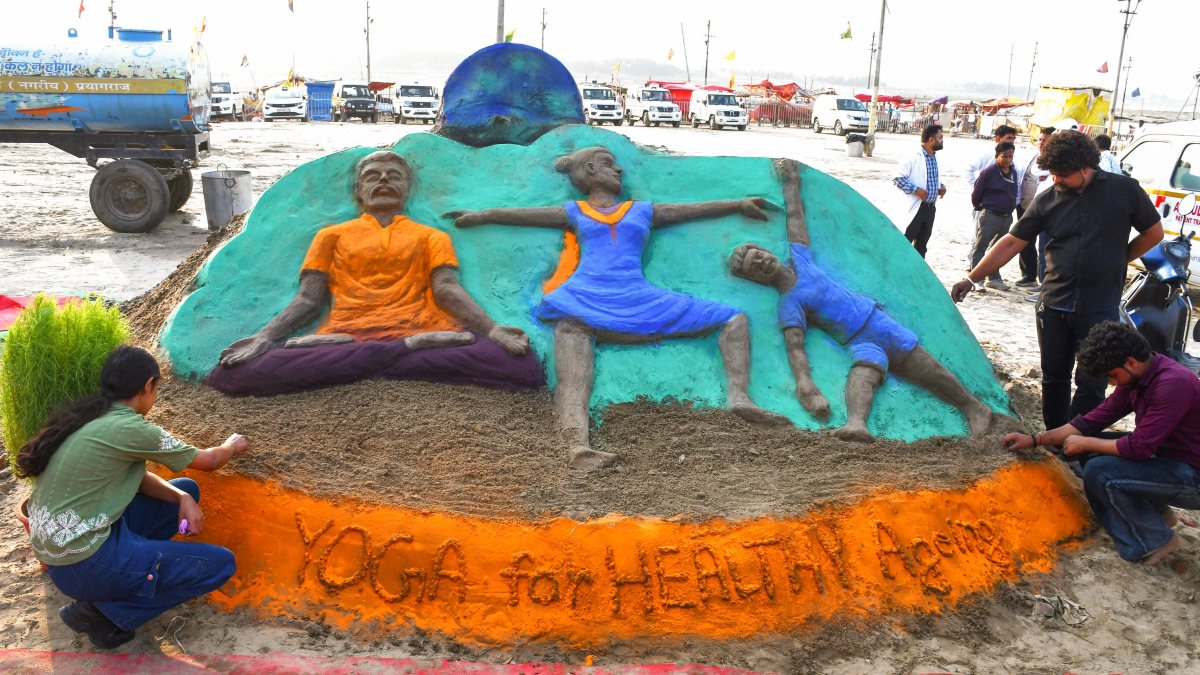 Youngsters create sand art for International Yoga Day