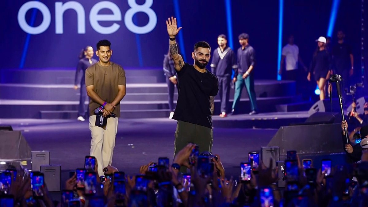 Virat Kohli greets crowd at one8 Global Premiere in Delhi