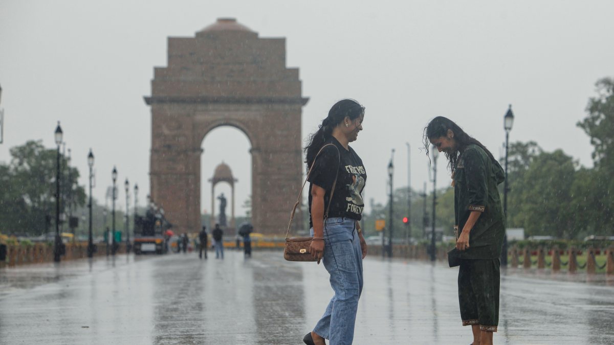 Girls enjoy monsoon showers at Kartavya Path in Delhi