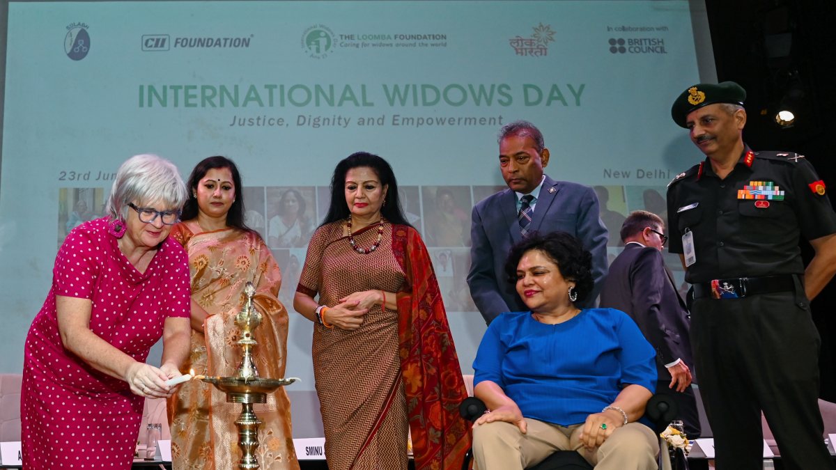 British Council official lights lamp at UN Widows Day event in Delhi