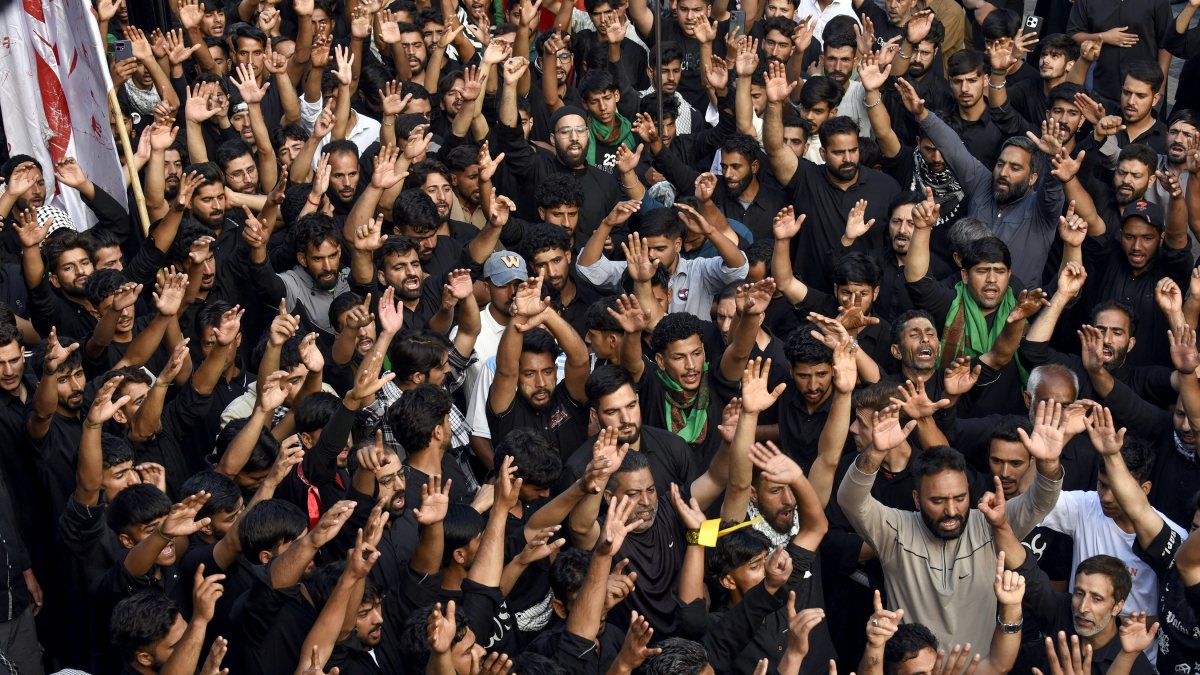 Shia Muslims take part in a procession on the eighth day of Muharram, in…