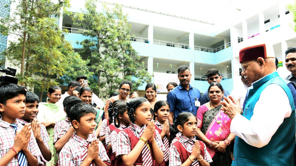 Telangana governor distributes notebooks at Hyderabad school event