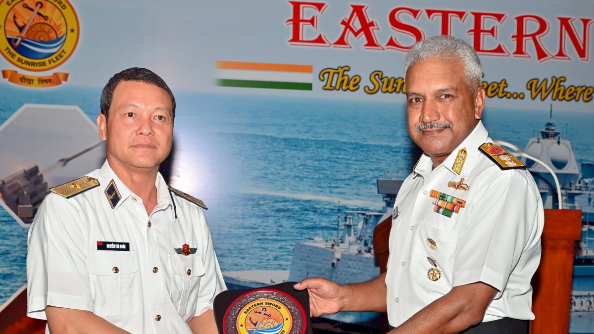 Rear Admiral Alok Ananda, Flag Officer Commanding Eastern Fleet, presents a…