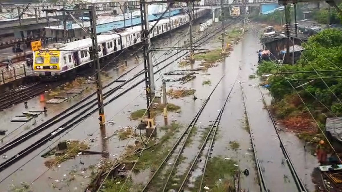 Mumbai train wades through waterlogged tracks at Dadar station