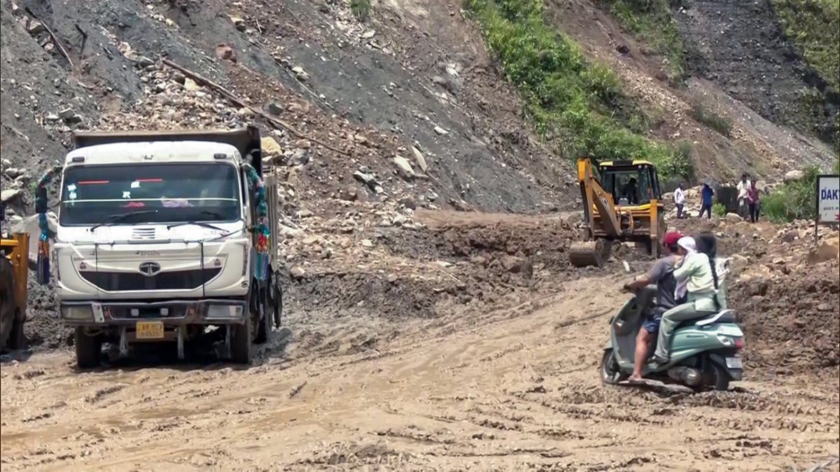 Commuters navigate debris on NH-13 after landslides in Arunachal
