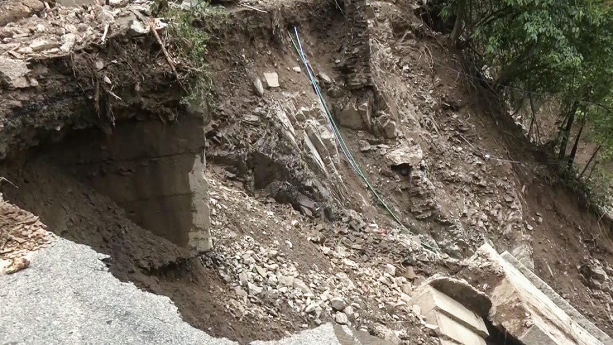 Broken path after cloudburst flash flood in Potin
