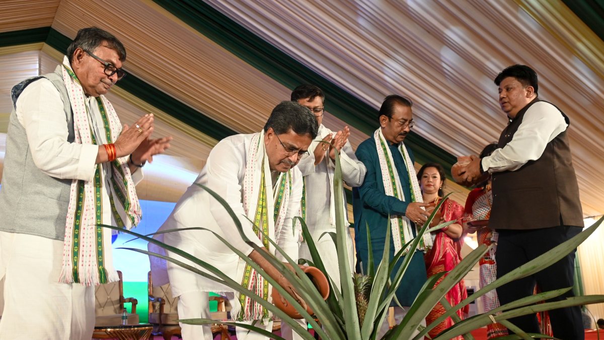 Tripura Chief Minister Manik Saha waters a pineapple sapling during the Tripura…