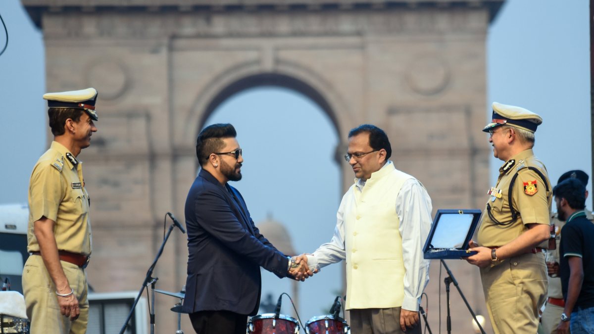 Union Home Secretary Govind Mohan exchanges a handshake with singer Mika Singh…