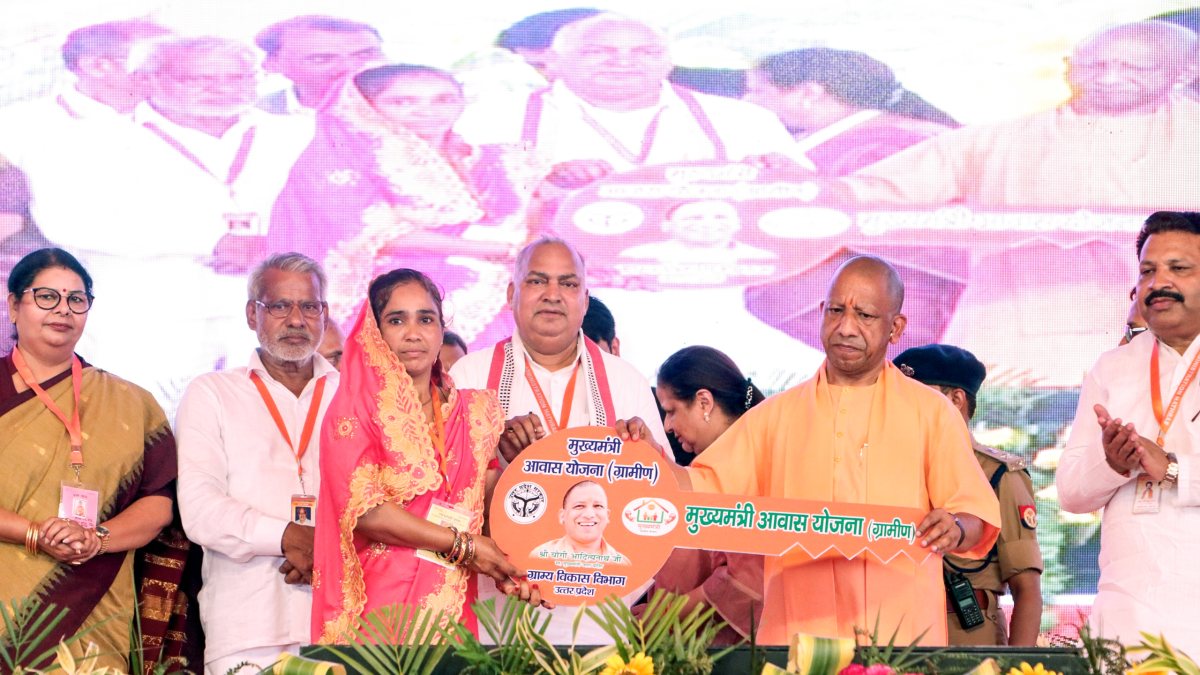 Uttar Pradesh CM Yogi Adityanath hands over house key in Hathras