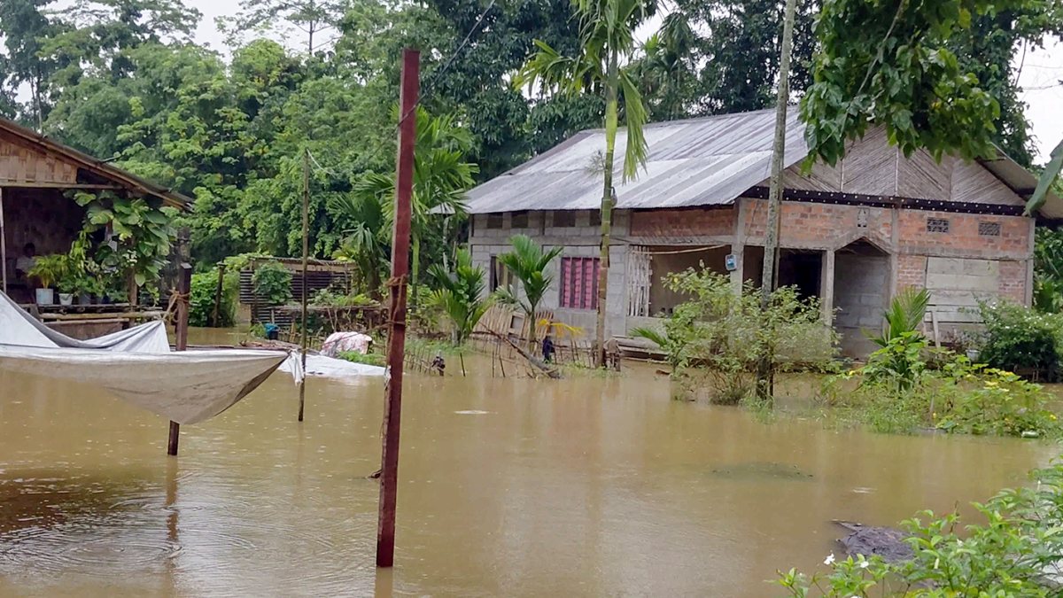 Floodwaters inundate low-lying areas and villages in Jonai following heavy…