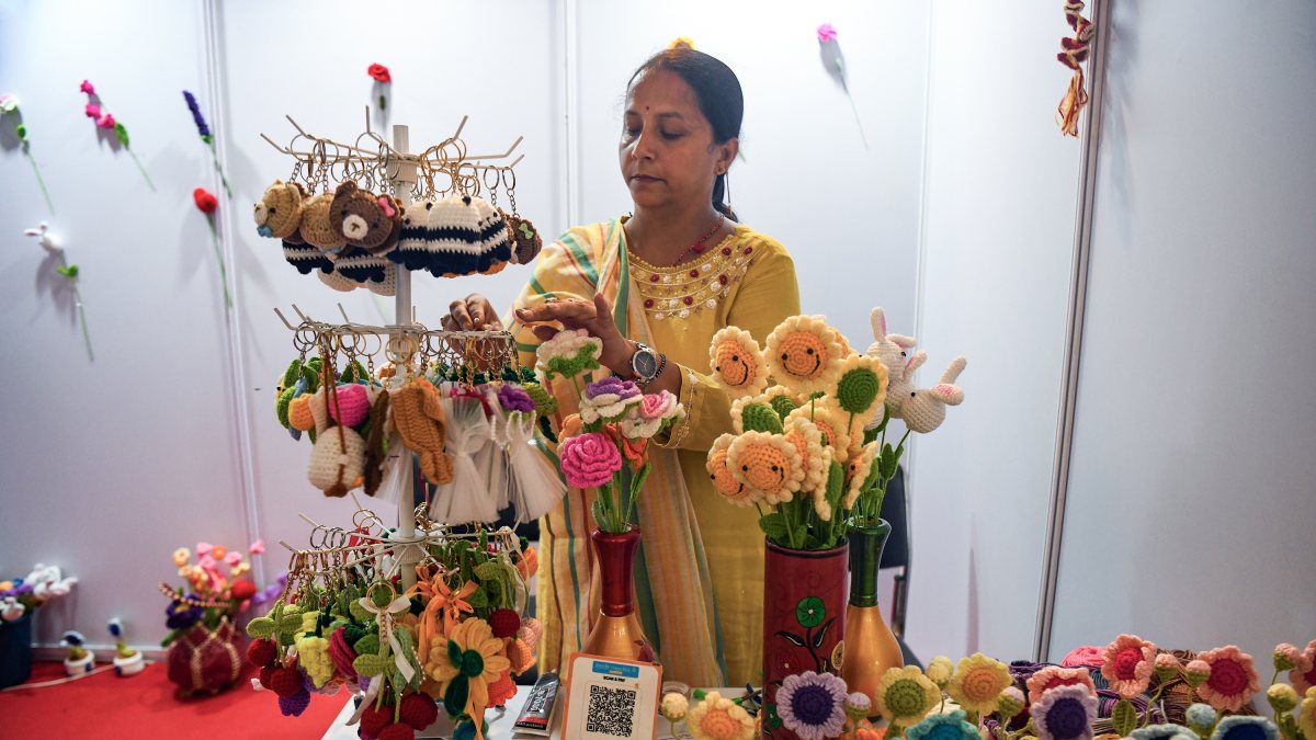 Artisan displays crochet goods at Srinagar buyer-seller meet