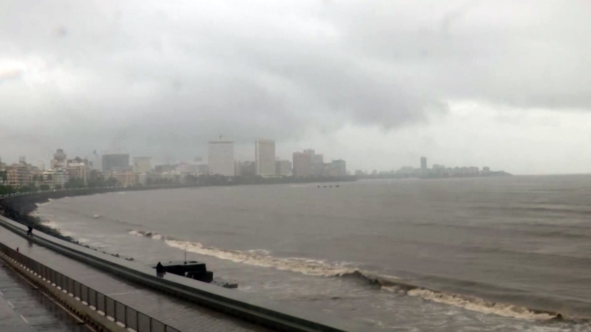 A view of the Marine Drive amid rainfall, in Mumbai on Monday. (ANI Video Grab)