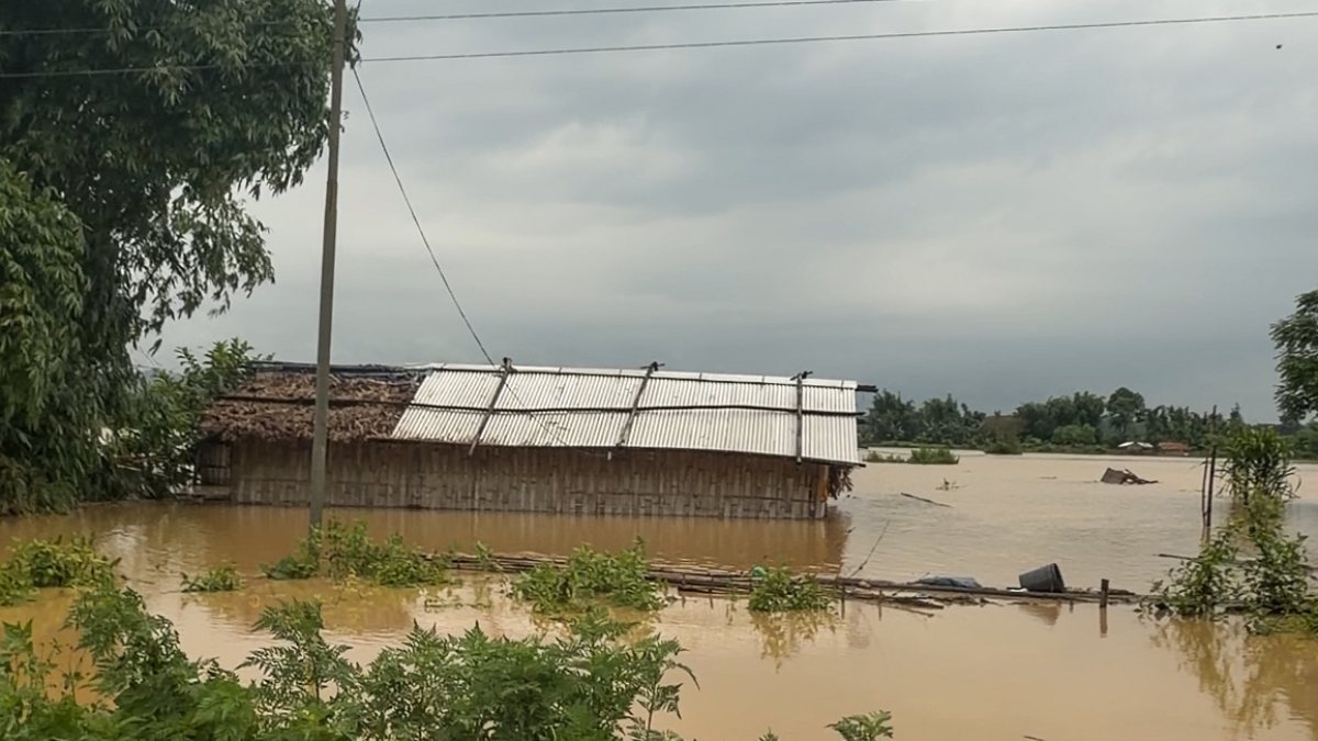 Flood waters submerge house in Dhemaji village