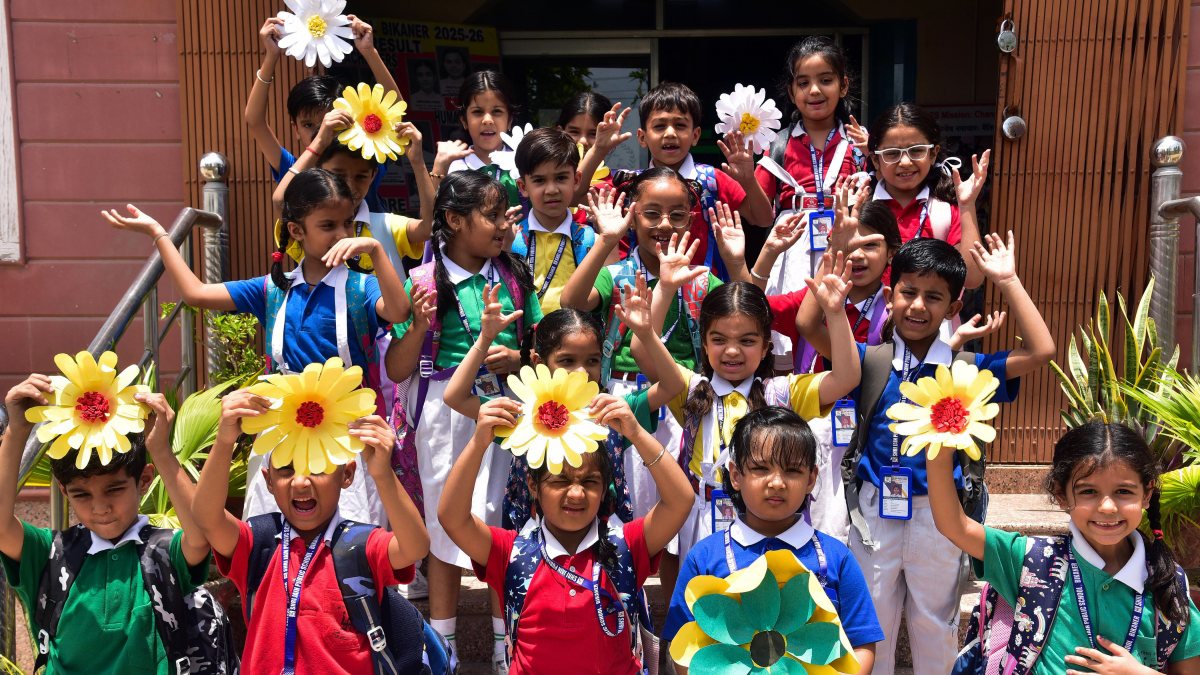 Students return to school with flowers after summer break